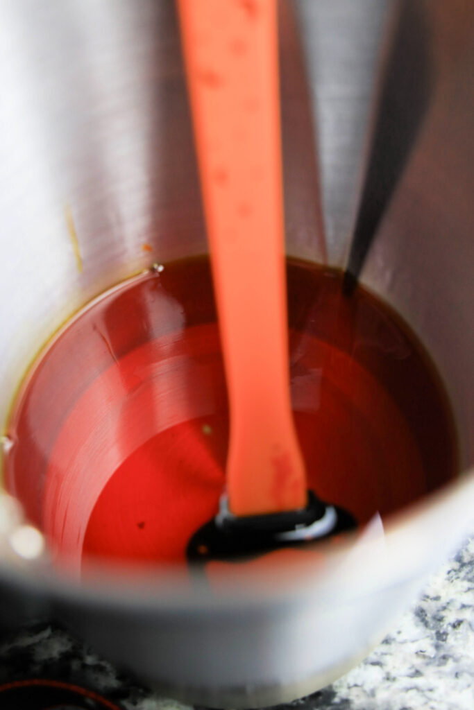 Red liquid in metal mixing bowl