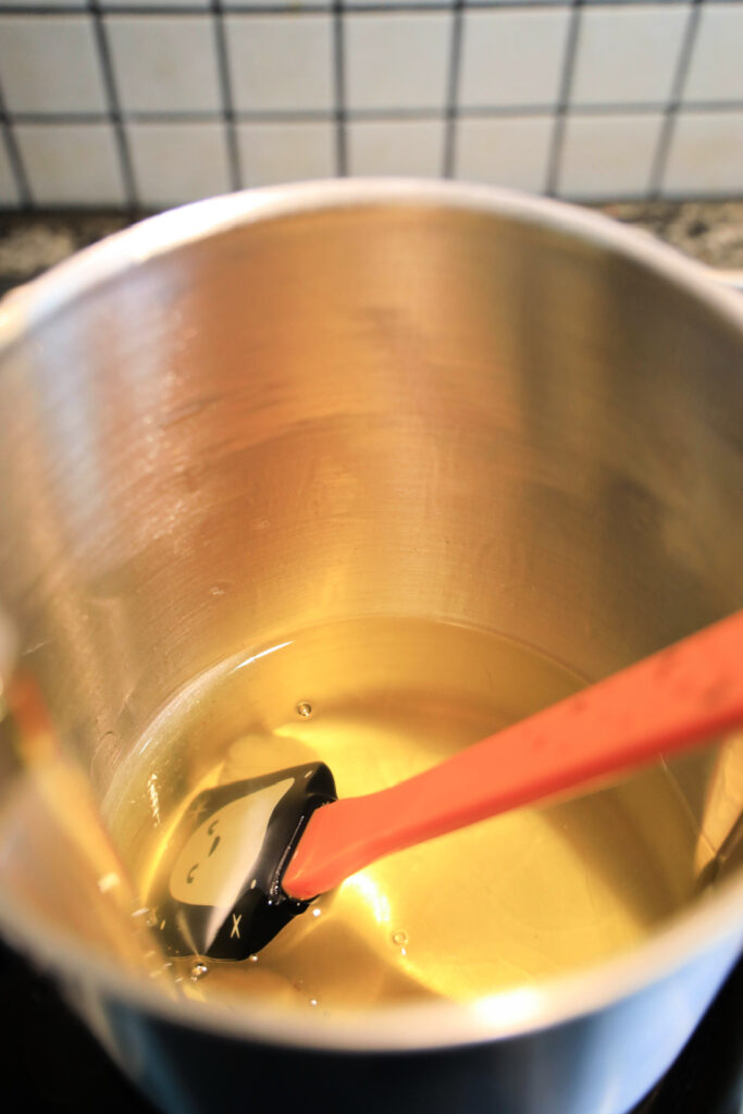 Melting wax in a pot.