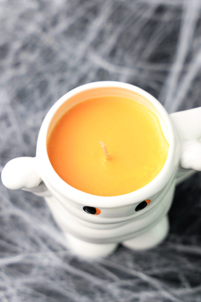White ghost candle with orange wax