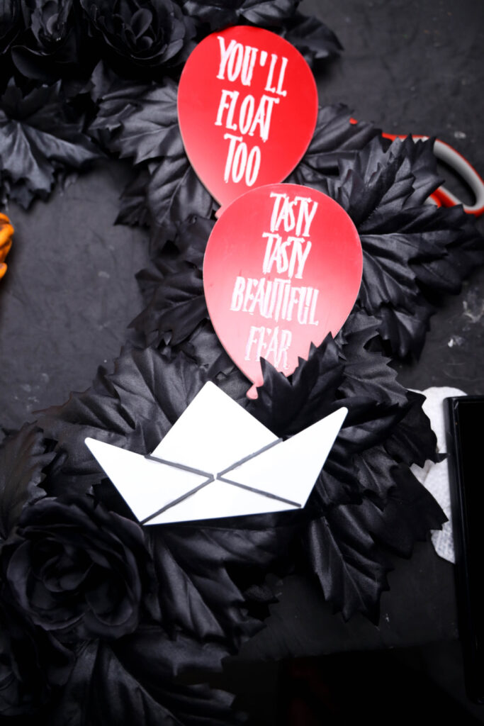 Black wreath with red balloons  IT Wreath