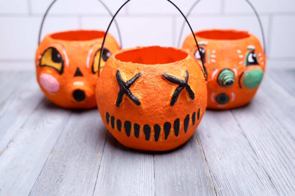 How to Make a Vintage Paper Mache Pumpkin (Trick 'r Treat Style) 6 Three painted Halloween pumpkin baskets